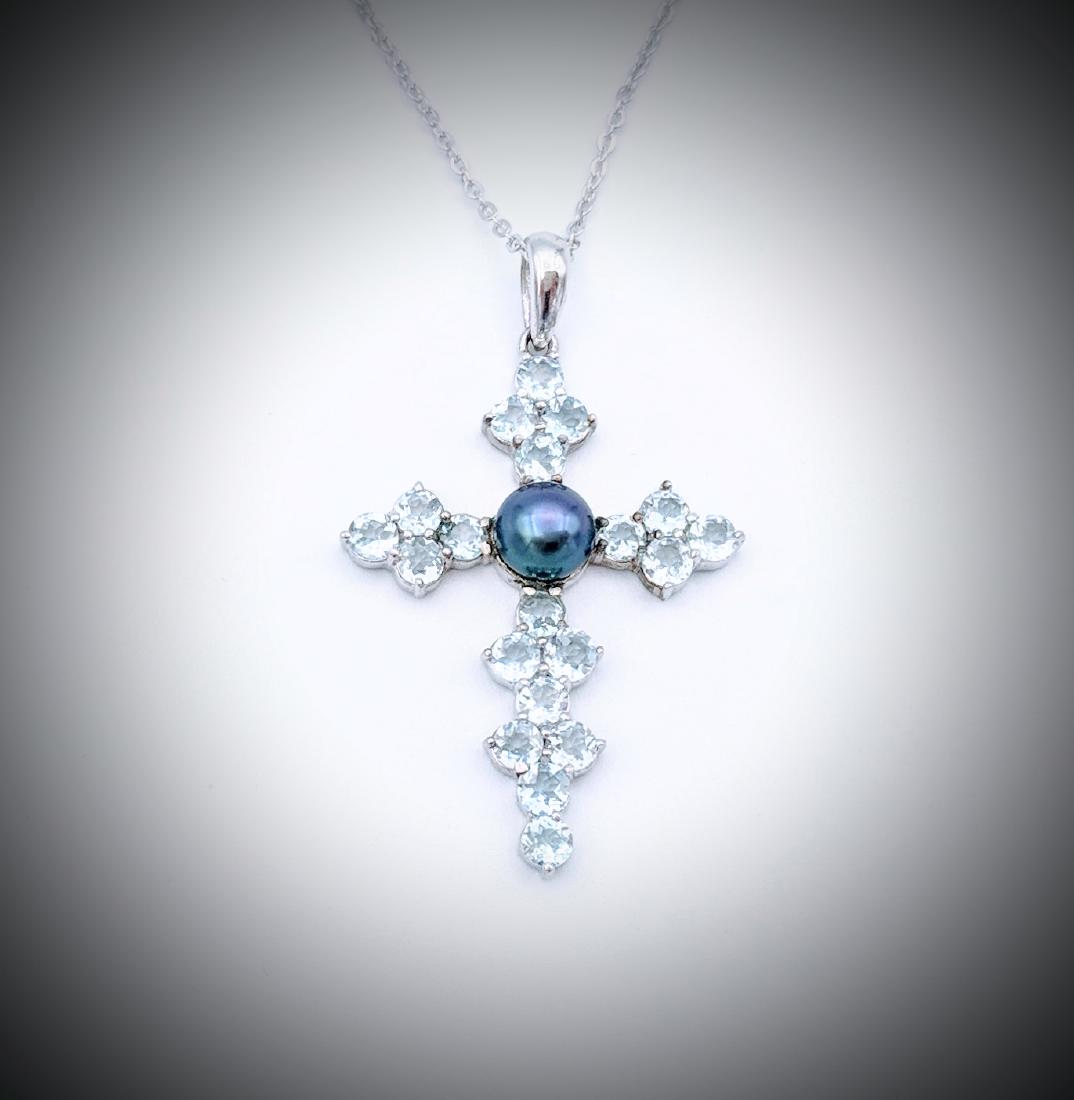 Sterling Silver Necklace with Tahitian Pearl, and Baby: Item: Sterling Silver Necklace with Tahitian Pearl, and Baby Sky Blue Topaz Cross Pendant Brand: Jean Lin Collection Metal Purity: 925 Sterling Silver Gemstones: Tahitian Pearl and Baby Sky Blue Topaz