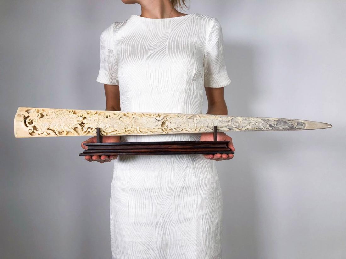 Large engraved Swordfish rostrum - Foo Dogs engraving: Large engraved Swordfish rostrum - Foo Dogs engraving Design: Jake Richmond Indonesia 2016 Bone, Wood Length of tusk: 81cm / 31.9 inches beautifully carved swordfish bill, a very impressive eye catche