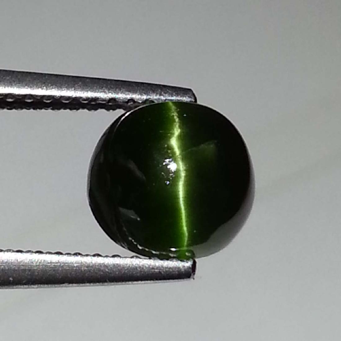 Natural Kornerupine Cat's Eye - 3.10 ct: Item: Natural Kornerupine Cat's Eye - 3.10 ct Color/Clarity: Opaque Loose gemstone Carat Weight: 3.1 Size (mm): 7.85 x 7.80 x 5.60 Round - Madagascar No Reserve: This lot starts at $1 and has no reser
