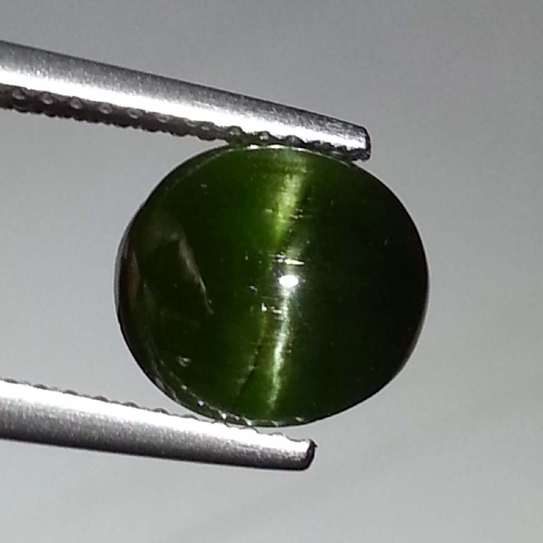 Natural Kornerupine Cat's Eye - 2.93 ct: Item: Natural Kornerupine Cat's Eye - 2.93 ct Color/Clarity: Opaque Loose gemstone Carat Weight: 2.93 Size (mm): 9.30 x 8.70 x 4.25 Oval - Madagascar No Reserve: This lot starts at $1 and has no reser