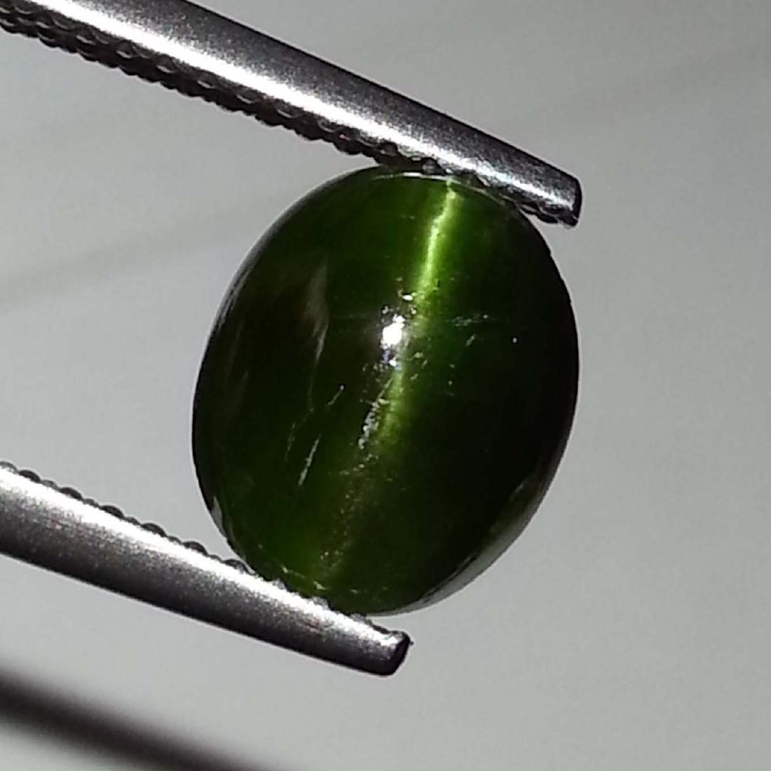 Natural Kornerupine Cat's Eye - 1.94 ct: Item: Natural Kornerupine Cat's Eye - 1.94 ct Color/Clarity: Opaque Loose gemstone Carat Weight: 1.94 Size (mm): 8.90 x 7.50 x 3.60 Oval - Madagascar No Reserve: This lot starts at $1 and has no reser