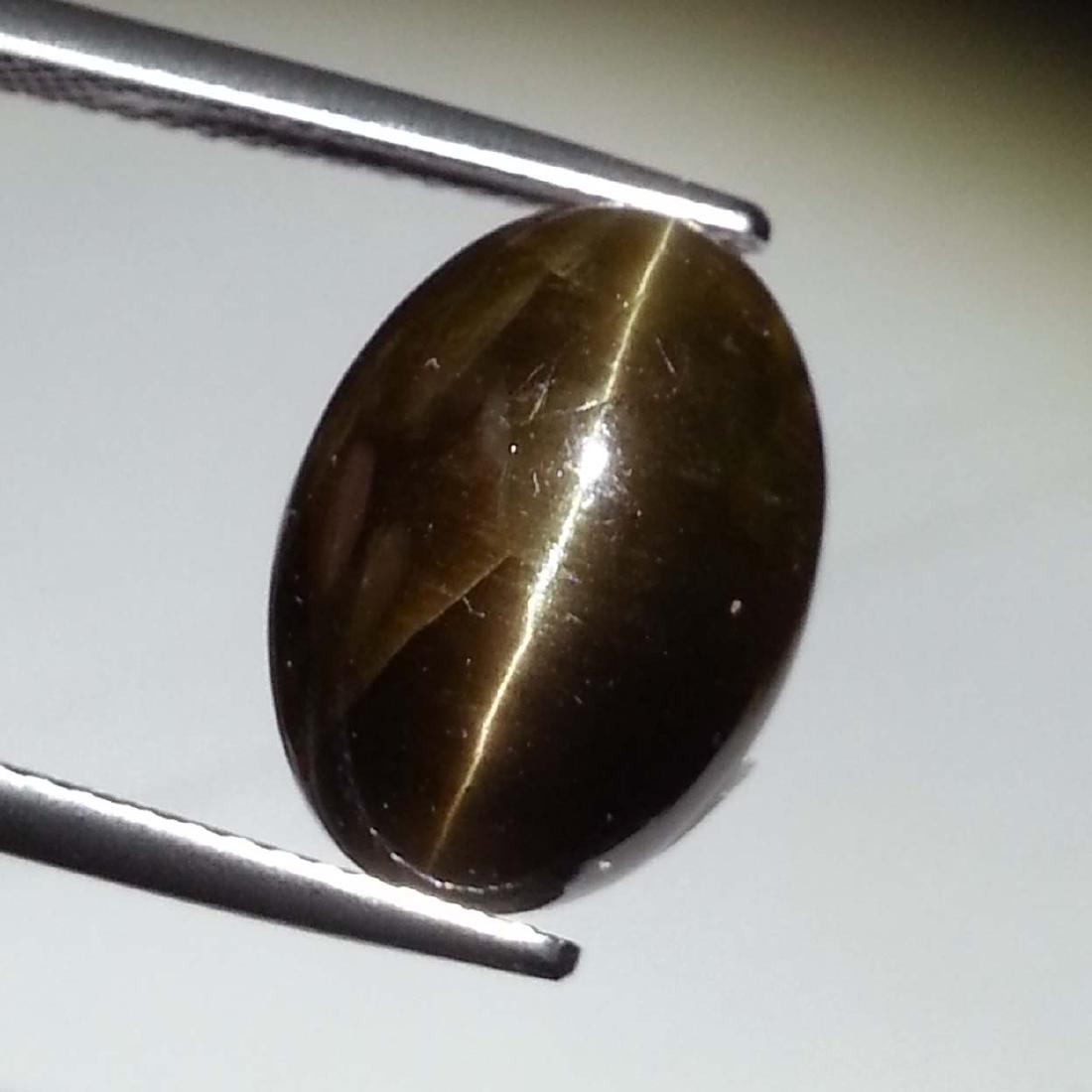 Top Grade Natural Apatite cat's Eye - 10.39 ct: Item: Top Grade Natural Apatite cat's Eye - 10.39 ct Color/Clarity: Opaque Loose gemstone Carat Weight: 10.39 Size (mm): 14.00 x 10.30 x 8.35 Oval - Africa No Reserve: This lot starts at $1 and has no