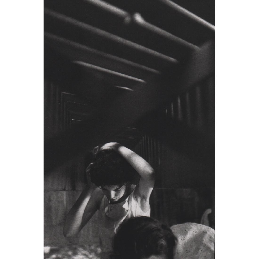 BRUCE DAVIDSON - Girl pinning her hair: Artist: BRUCE DAVIDSON Print Title: Girl pinning her hair Medium: Sheet-fed Gravure Printing Date: 1990's Printed in Japan Image Size: 5.25 x 8 inches Bruce Davidson is an American photographer. He ha