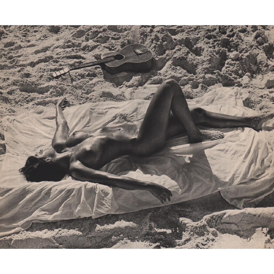 ANDRE DE DIENES - Nude on the Beach: Artist: ANDRE DE DIENES Print Title: Nude on the Beach with guitar Medium: Sheet-fed Gravure Printing Date: 1950s Printed in France Image size approx. 9 x 7.5 inches Andre De Dienes (1913-1985) was a