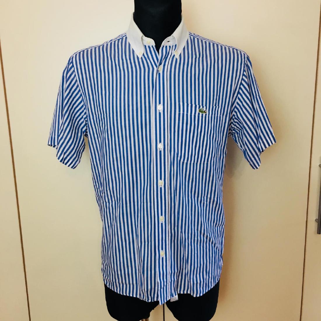 Men's Lacoste Blue Striped Short Sleeve Shirt Size 39 /: Men's Lacoste Blue Striped Short Sleeve Shirt Size 39 / M Modern Cotton 39 / M Armpit to Armpit: 21.5 in. Shoulder to shoulder: 18 in. Sleeve from shoulder seam: 27 in. Please note that this lot has a