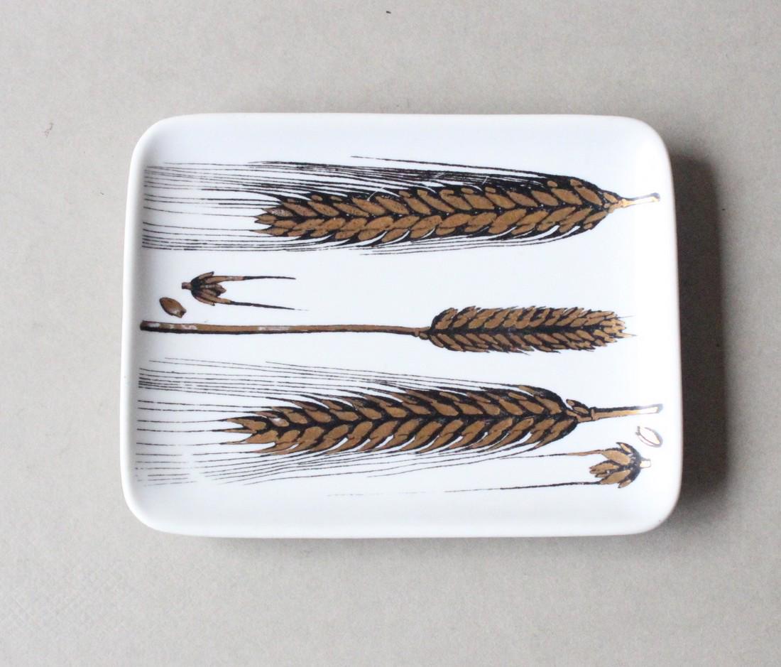Fornasetti Gold & Black Plate Wheat Tray,c.1950’s: Title: Fornasetti Gold & Black Plate Wheat Tray,c.1950’s Maker: Piero Fornasetti Origin: Italian Date/Period: 1950's Materials: Porcelain Size: 5.5"x4" Fornasetti Gold & Black Plate Wheat Porcelain