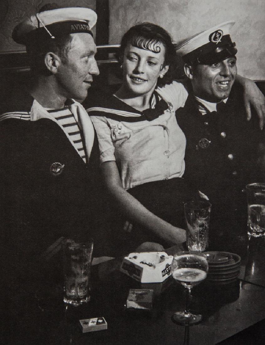 BRASSAI - Conchita with Sailors: Artist: Brassai Title: Conchita with Sailors Medium: Sheet Fed Gravure, 1976, USA Dimensions: 7.5x9.5" Heat Wax Mounted on 11x14" Conservation Board Brassai was a Hungarian-French photographer who ros