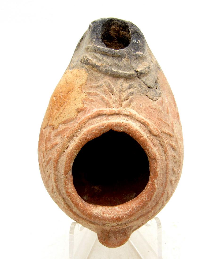 Ancient Byzantine Terracotta Oil Lamp with Laurel: Ancient Byzantine Terracotta Oil Lamp with Laurel Date: C. 330 A.D. Mould-made unglazed terracotta with impressed laurel wreath decoration. Material: terracotta Obtained from an old British collection