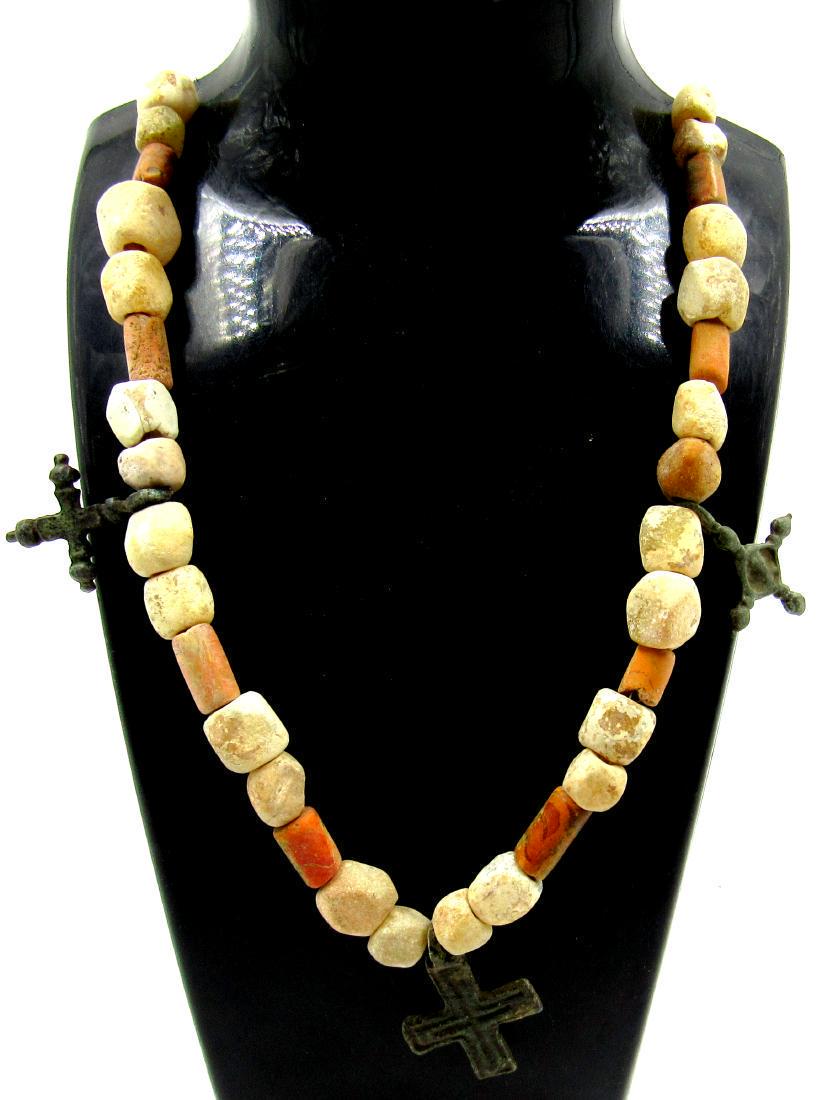 Viking Glass and Stone Necklace with Crosses: Viking Glass and Stone Necklace with Crosses Date: C. 900 - 1100 A.D. Beautiful, Medieval Viking Era Necklace, co,mposed of numeroud glass and stone beads; three crosses attached. The item is suitable