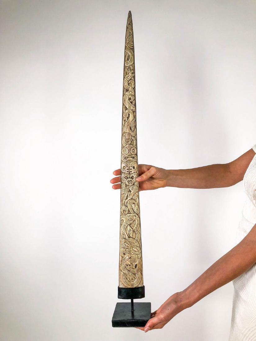 Traditional Maori Style Wheku and Tiki carved swordfish: Title: Traditional Maori Style Wheku and Tiki carved swordfish tusk Maker: Unknown Origin: Indonesia Date/Period: 2016 Materials: Bone Dimensions: Height including stand 85 cm / 33.5 inches Swordfish 