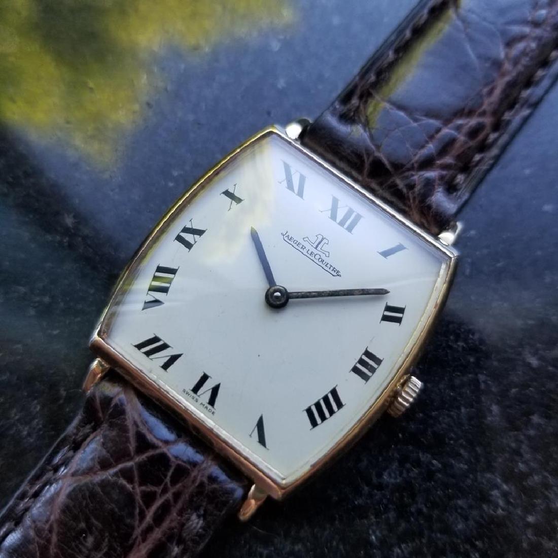 JAEGER LECOULTRE Men's Midsize/Unisex 18K Gold Tonneau: Sophisticated elegance, men's midsize/unisex 18K solid gold Jaeger LeCoultre thin Tonneau Classic manual hand-wind dress watch, c.1960s. Verified authentic by a master watchmaker. Clean white JLC dial