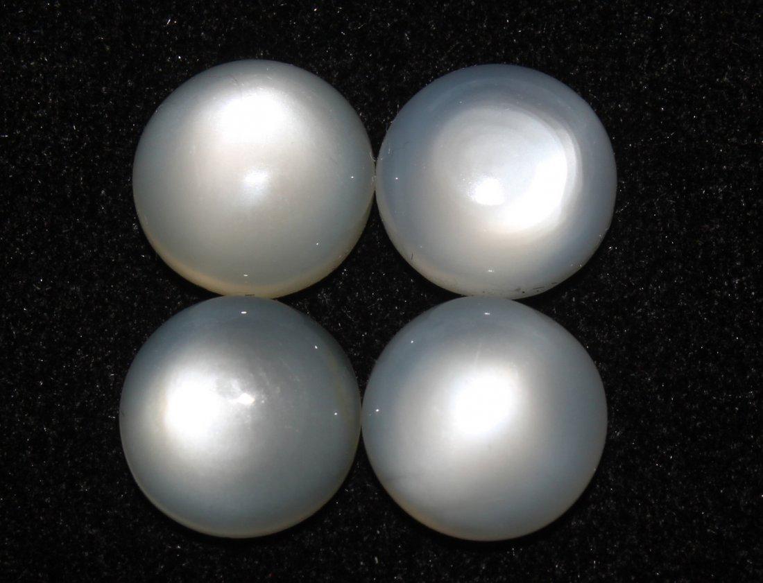 14.15 Ct Natural Moonstone Set: Gemstone : Moonstone Origin: India Weight: 14.15 carats total Dimensions: 10 mm calibration Shape/Cut: Round Cabochon Quantity : 4 Pcs Colour: White Transparency: Translucent Clarity: No