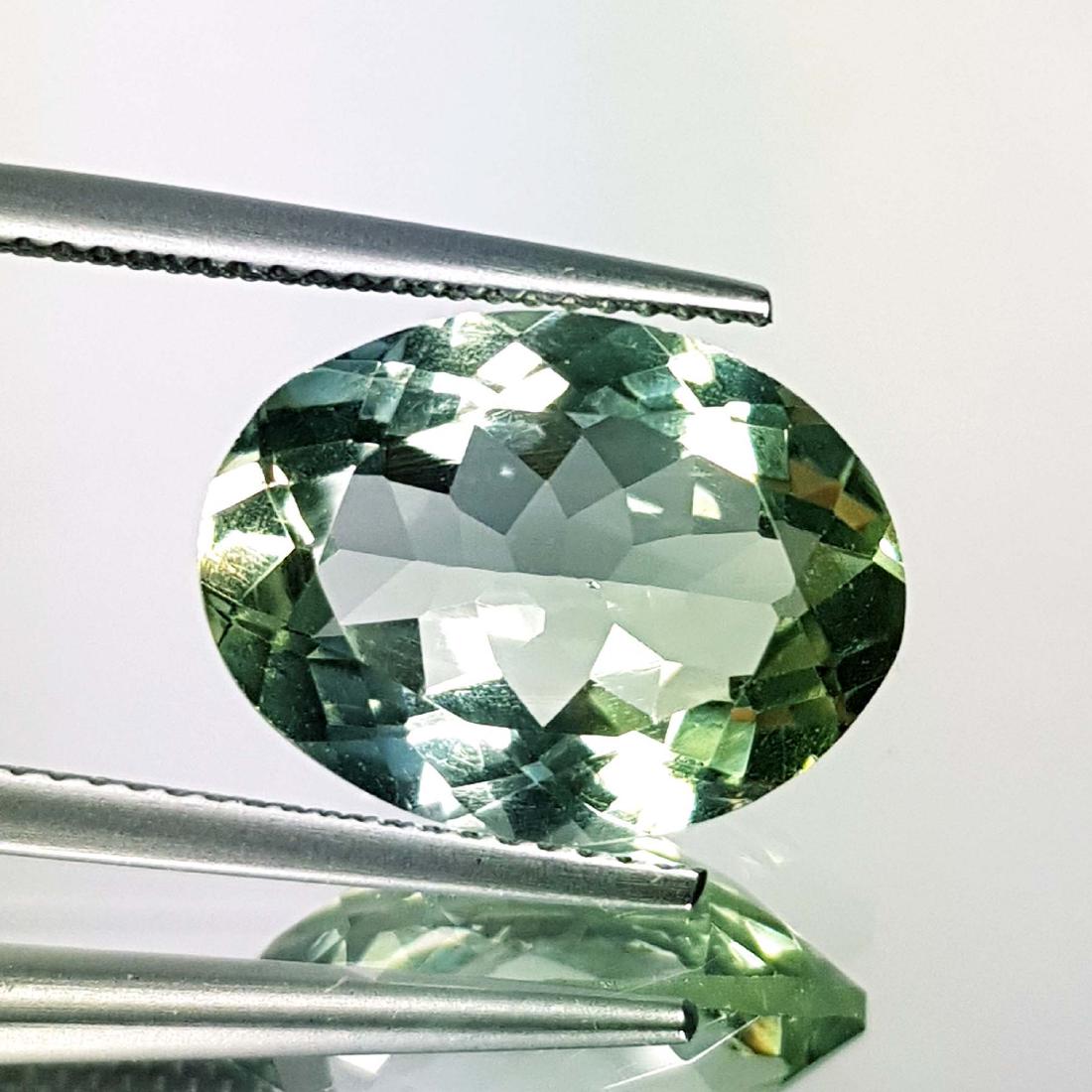 Stunning Luster Natural Green Amethyst - 11.70 ct: Item: Stunning Luster Natural Green Amethyst - 11.70 ct Color/Clarity: IF - VVS Loose gemstone Carat Weights: 11.7 Size (mm): 18.50 x 14.00 x 7.60 Oval - Brazil No Reserve: This lot starts at $1 and h