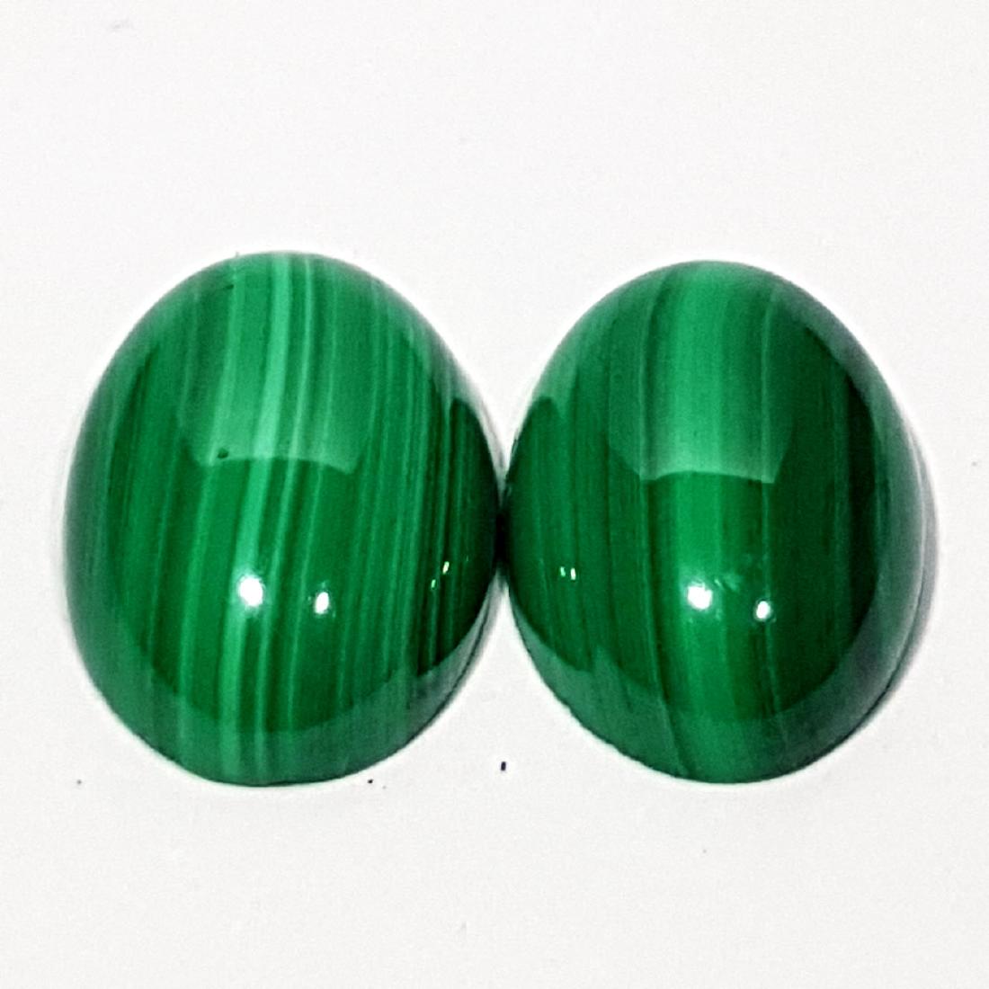 2 Pcs of Wonderful Oval Cut Natural Malachite - 13.45: Item: 2 Pcs of Wonderful Oval Cut Natural Malachite - 13.45 ct Color/Clarity: Opaque Loose gemstone Carat Weights: 13.45 Size (mm): 14.00 x 10.10 x 4.50/13.80 x 9.98 x 4.44 Oval - Africa No Reserve: T
