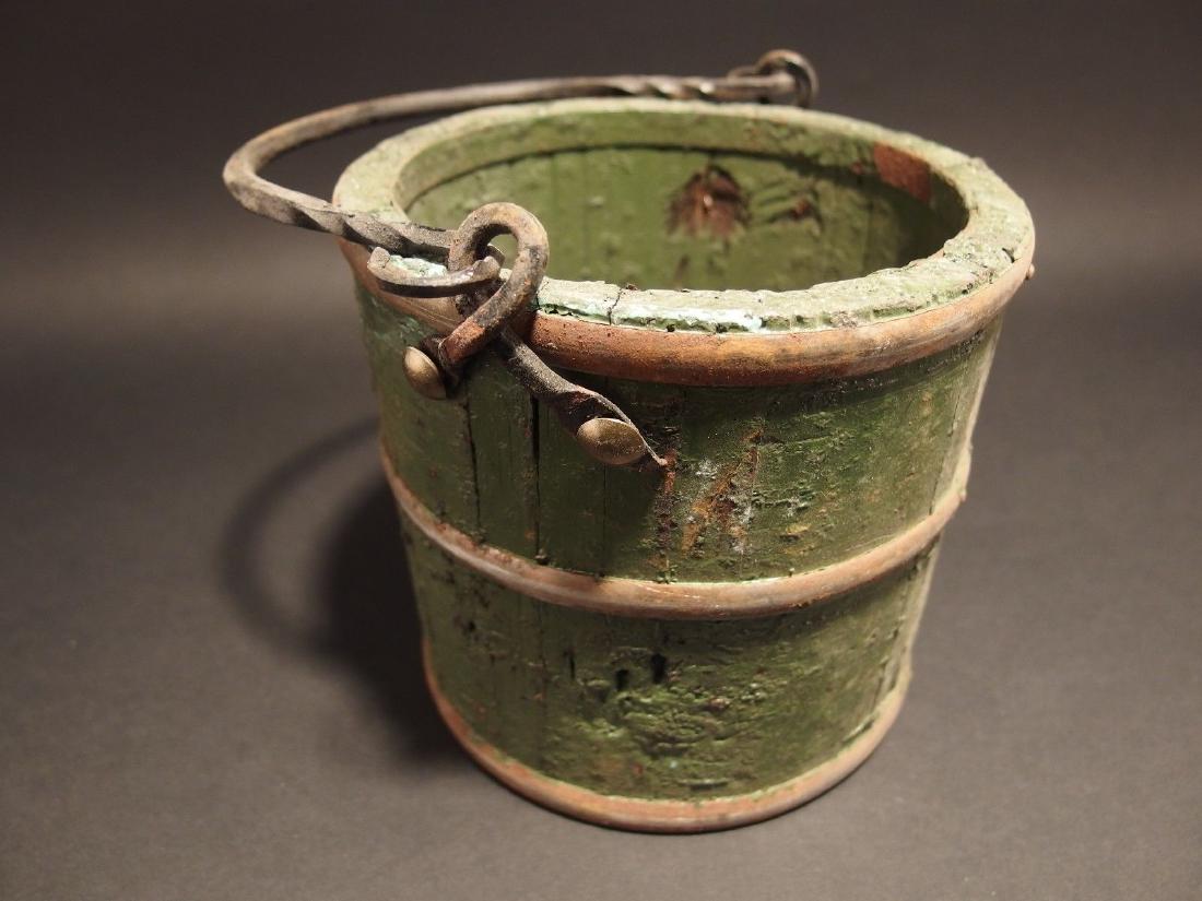 Wood Berry Bucket Iron Handle old Green Paint: Primitive Antique Style Colonial Wood Berry Bucket w Iron Handle old Green Paint Description 6" Wide 5" tall 9 1/2" Tall with handle Nice Reproduction wood berry bucket with handmade iron straps and c