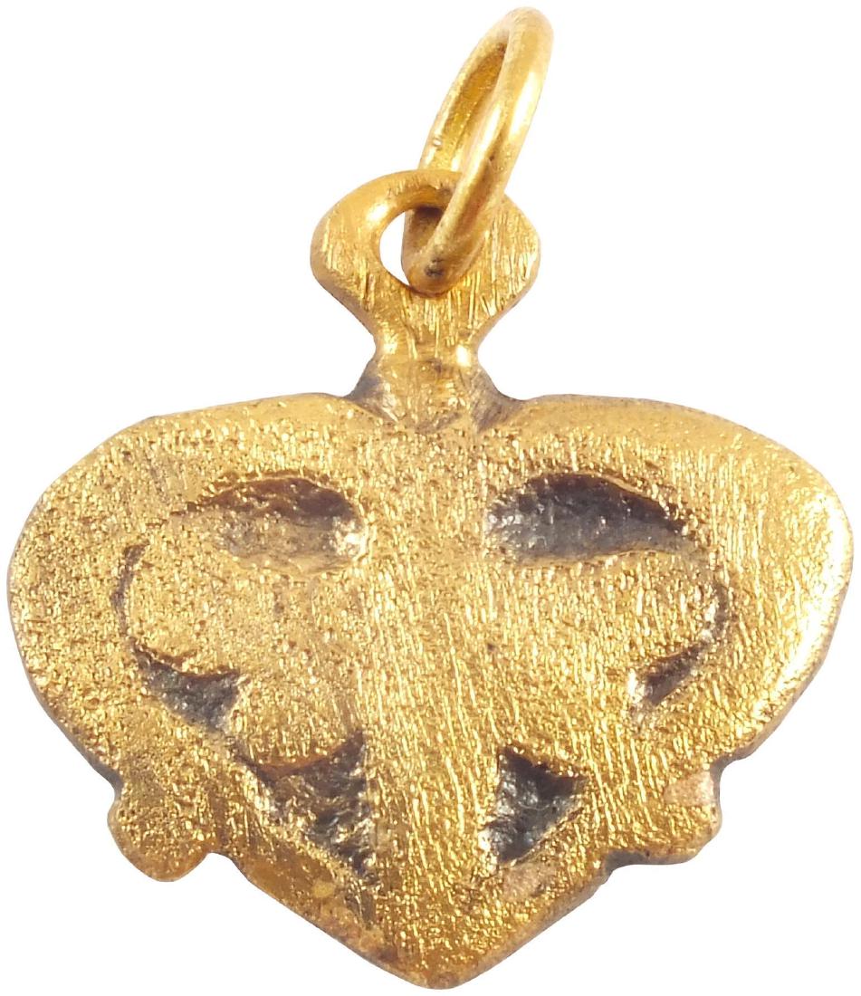 VIKING HEART PENDANT C. 900-1000 AD: Early example of the fully evolved form with cusped top and near rounded sides. Very slightly domed with large central trefoil motif, the upper members comprising the scrolled border terminal. Just ov