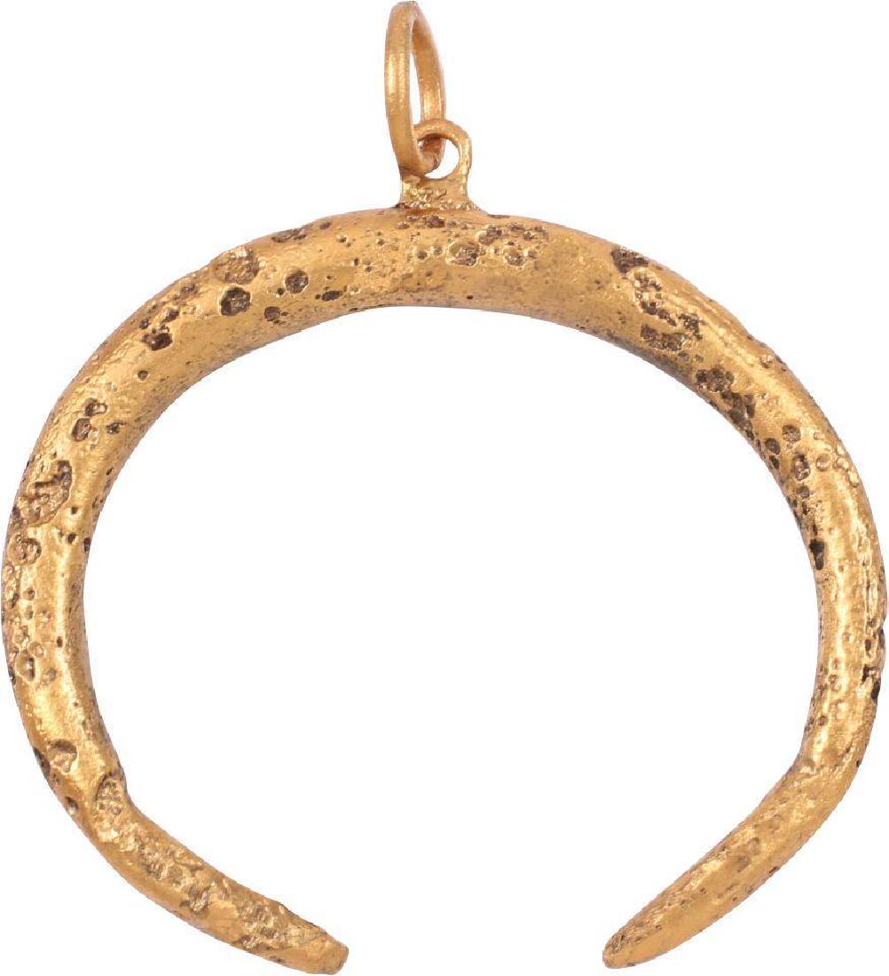 VIKING LUNAR/ASTROLOGICAL PENDANT C.850-950 AD: Gilt bronze. Very large, just under 1 ½" wide. As expert navigators, the constellations signified mystery and power to Vikings. The Moon was personified as Mani, brother to Sol the Sun, and is abunda