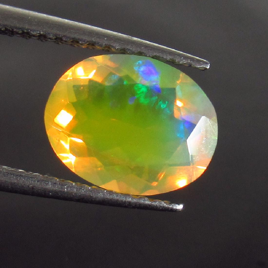 1.34 Ct Genuine Ethiopian Honey Fire Faceted Opal 9X7 (1 of 2)