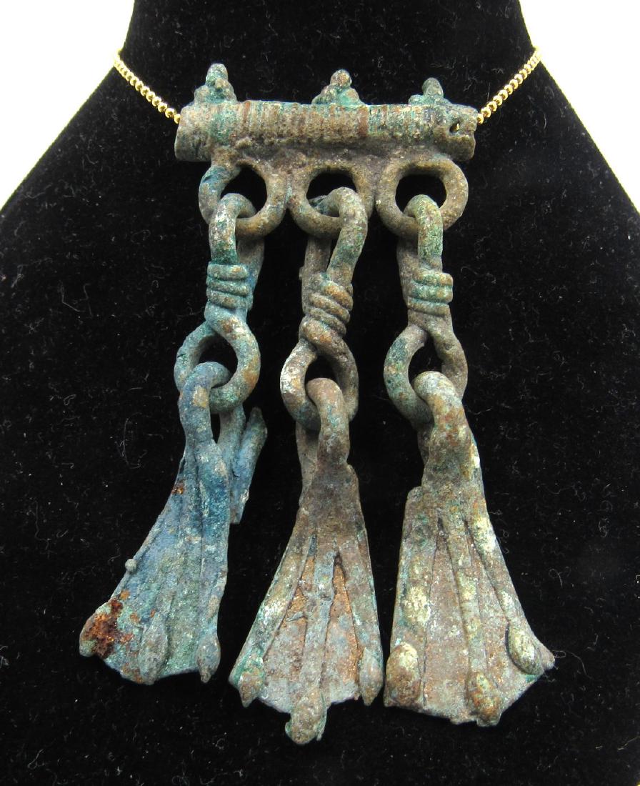 Medieval Viking Era Bronze Pendant with Goose Foot: Medieval Viking Era Bronze Pendant with Goose Foot Tassels Circa 900 – 1100 AD Medieval Viking Era Bronze Pendant with Goose Foot Tassels. This item has been professionally cleaned to show original 