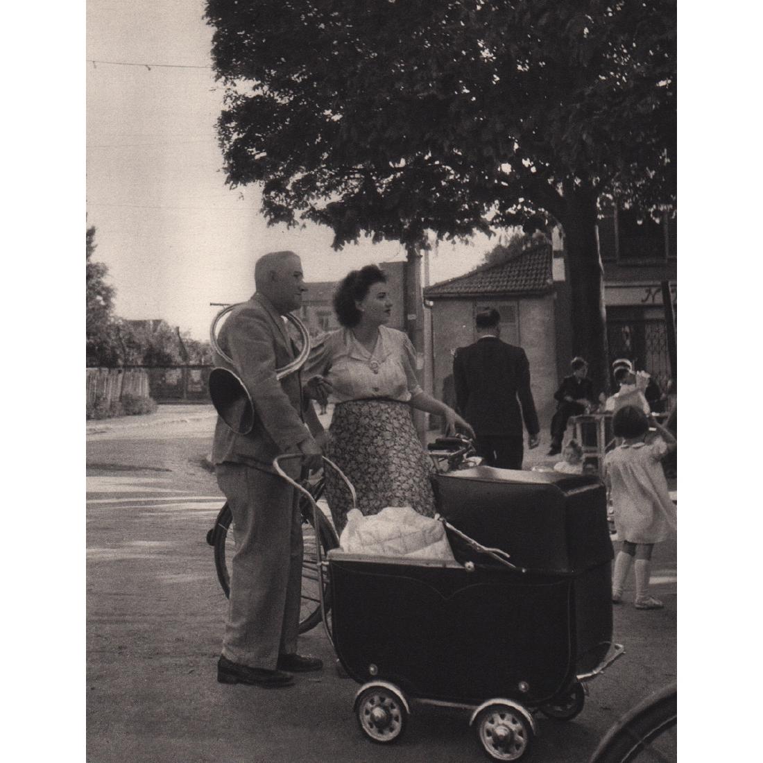 ROBERT DOISNEAU - Sunday in the Suburbs: Artist: ROBERT DOISNEAU Print Title: Sunday in the Suburbs with the Family Medium: Sheet-fed Gravure Printing Date: 1940's Printed in Switzerland Image Size: 6.25 x 7.75 inches Robert Doisneau (1912-1