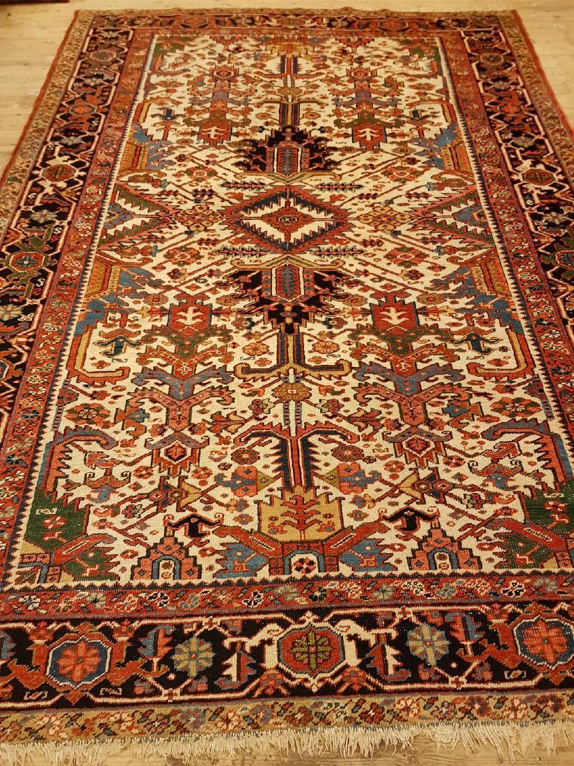 Persian Antique Heriz Rug 10.1x7: This carpets is knotted in northwestern Persia. The carpet is often large and very durable and therefore suitable for hallways and public environments. The wool is cut short to an average length, and