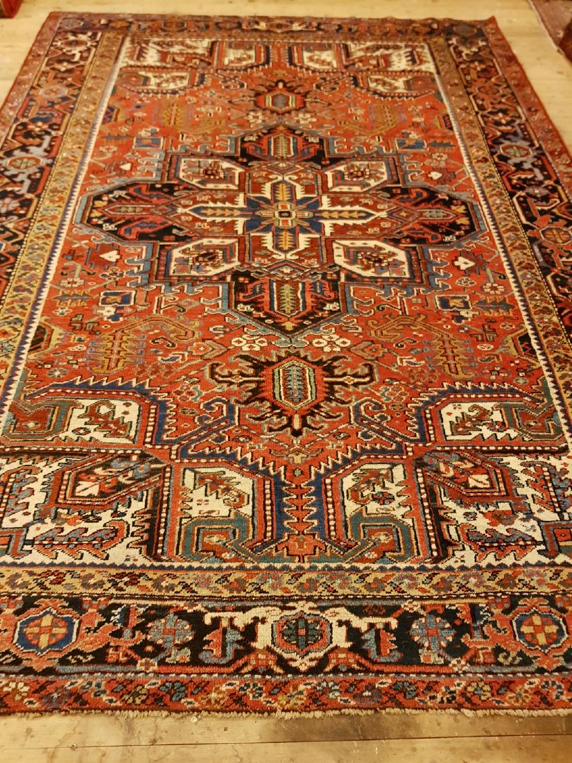 Persian Antique Heriz Rug 10.1x7.6: This carpets is knotted in northwestern Persia. The carpet is often large and very durable and therefore suitable for hallways and public environments. The wool is cut short to an average length, and