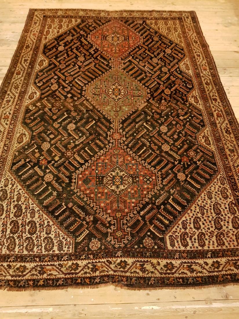 Persian Antique Ghashghai Rug 7.9x5.6: This carpet is knotted by nomads from the highlands in southwestern Persia. The carpet has a very high knot density for a nomad carpet and the motifs are among the most exciting and varying in carpets