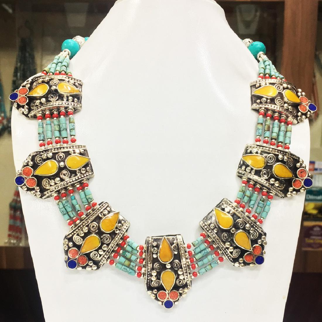 Nepalese Tibetan Silver Tibetan Women's Necklace: Item: Nepalese Tibetan Silver Tibetan Women's Necklace Handmade Origin: Tibetan Metal Purity: Tibetan silver Gemstones: Turquoise & Coral Size (inches): 20 Please note that this lot has a confidential