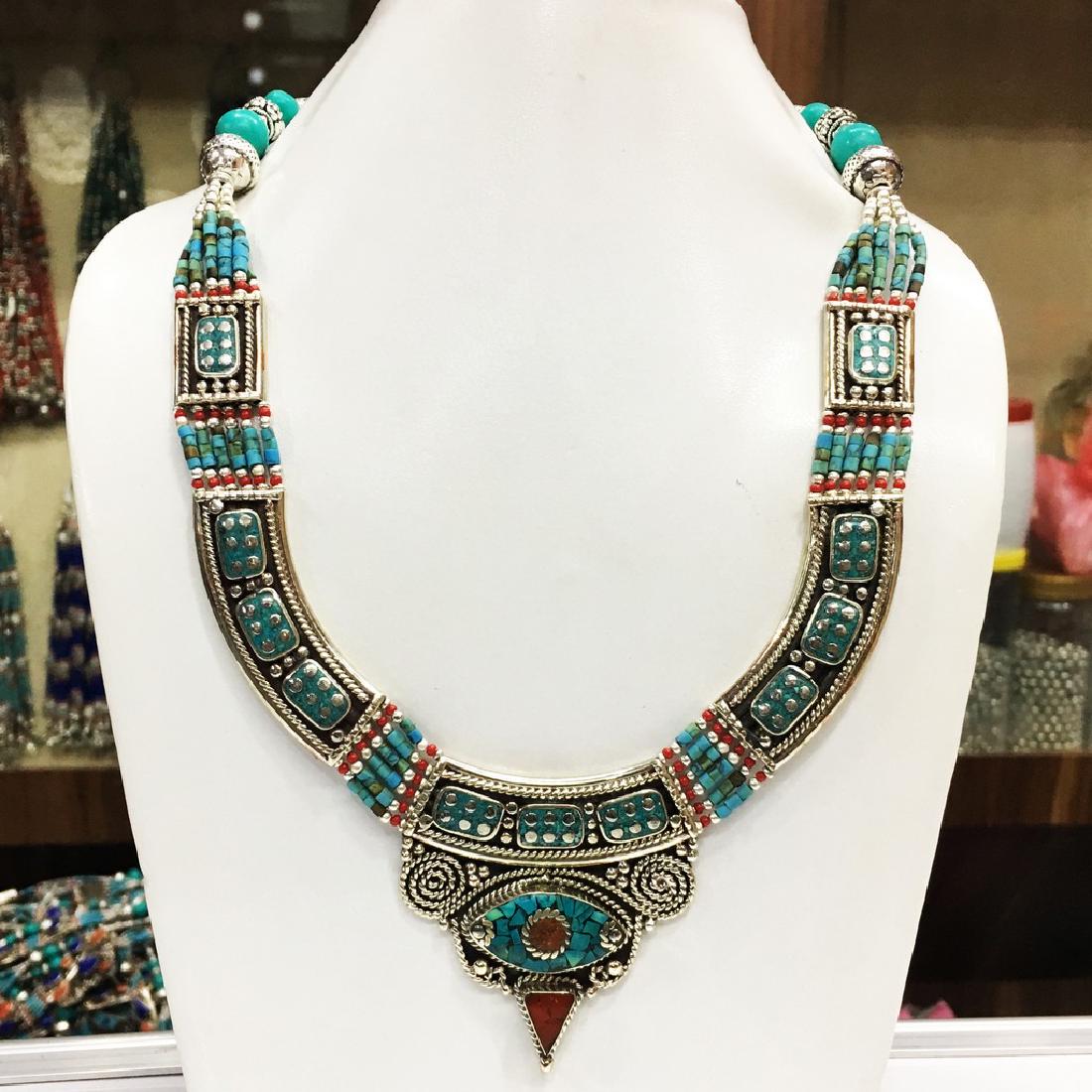 Nepalese Tibetan Silver Tibetan Women's Necklace: Item: Nepalese Tibetan Silver Tibetan Women's Necklace Handmade Origin: Tibetan Metal Purity: Tibetan silver Gemstones: Turquoise & Coral Size (inches): 1-19 Please note that this lot has a confidenti