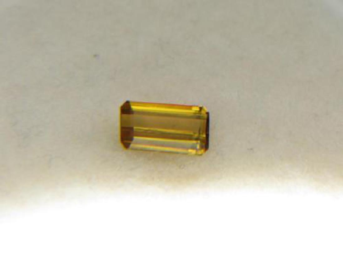 1.30 ct Clinozoisite: Pieces: 1 Shape: Emerald Facet Type: Cliniozoisite; A complex calcium aluminium sorosilicate mineral with formula: Ca2Al3(Si2O7)(SiO4)O(OH) Color: Brownish Yellow Weight: 1.30 CT Clarity: VS1-2 (Type
