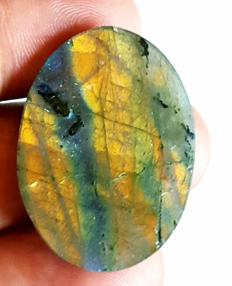SUPREME QUALITY NATURAL LABRADORITE IN EXCELLENT: Item: SUPREME QUALITY NATURAL LABRADORITE IN EXCELLENT CUTTING Origin: africa Weight: 23 carat No Reserve: This lot starts at $1 and has no reserve as a courtesy so that collectors can determine the t