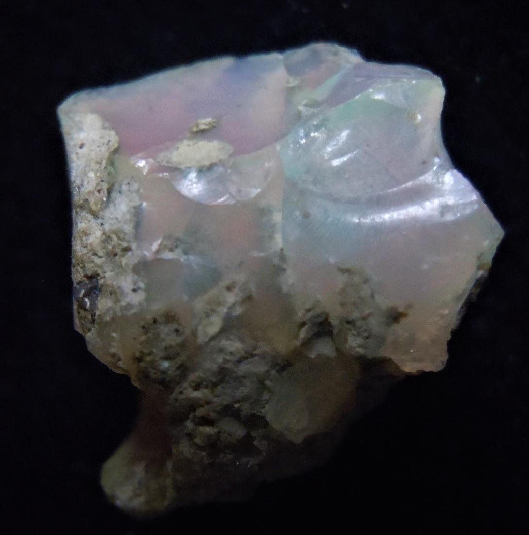 4.4 cts. Opal from Ethiopia: Item: 4.4 cts. Opal from Ethiopia Origin: South Wello, Amhara Province, Ethiopia Size: 1.35x1.23x0.75 cm / 0.88 gram Additional Information: milky white, translucent opal with minor play-of-color. Fla