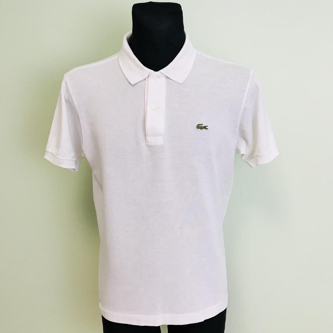Men's Lacoste White Polo Shirt Size 4 / Medium: Men's Lacoste White Polo Shirt Size 4 / Medium Modern Cotton 4 / Medium Armpit to Armpit: 21 in. Please note that this lot has a confidential reserve. When you leave a bid in advance of the auction, s