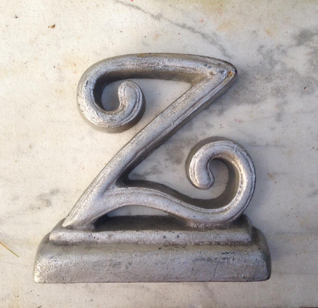 Mid 20thc Cast Iron z Doorstop in Old Dull Silver Paint: Mid 20thc cast iron "Z" doorstop in old dull silver paint. Mid 20thc 6" x 6" Please note that this lot has a confidential reserve. When you leave a bid in advance of the auction, submit your maximum. 