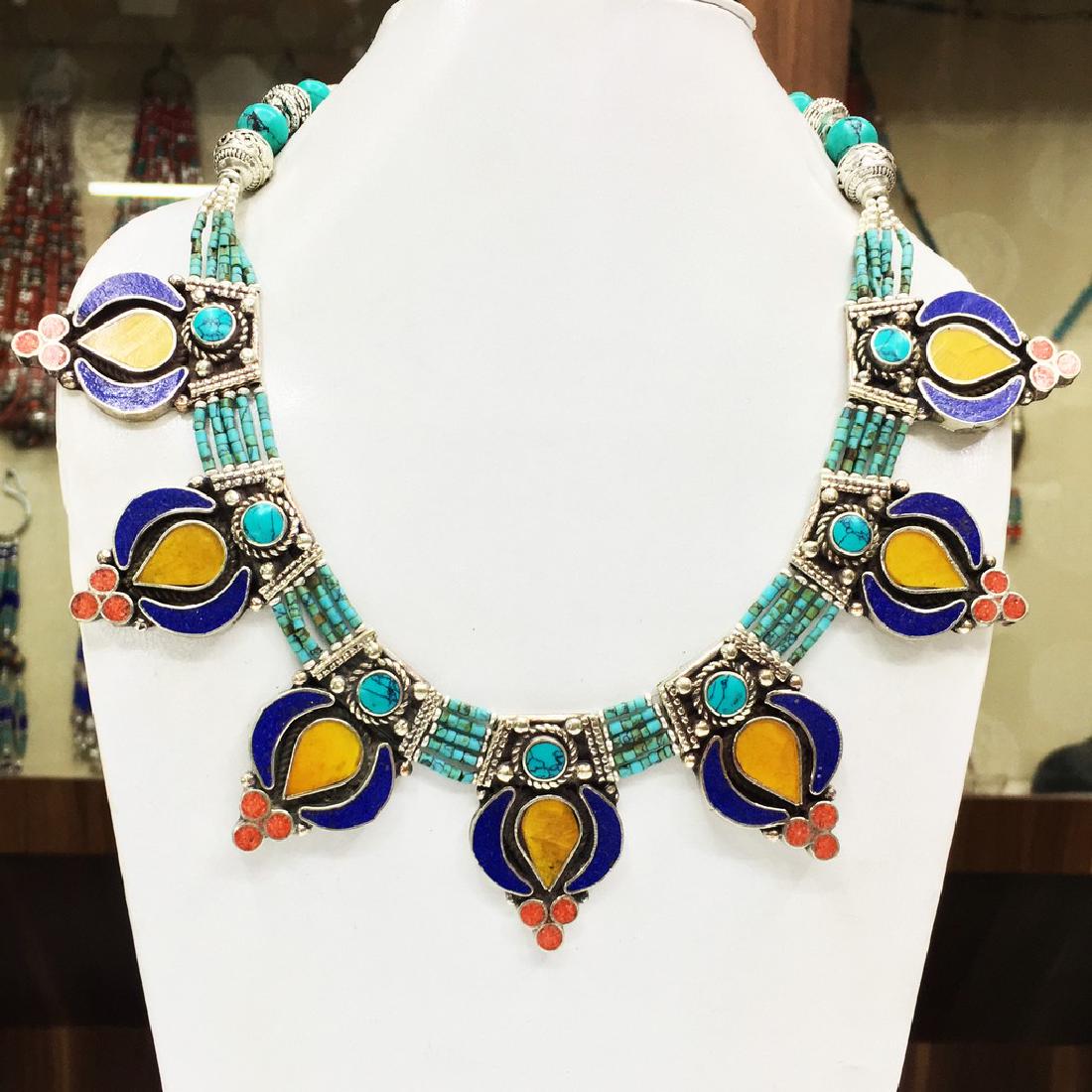 Nepalese Big Tibetan Silver Lapis & Coral Choker: Item: Nepalese Big Tibetan Silver Lapis & Coral Choker Handmade Necklace Handmade Origin: Tibetan Metal Purity: Tibetan silver Gemstones: Turquoise & Coral Size (inches): 20 Please note that this lot 