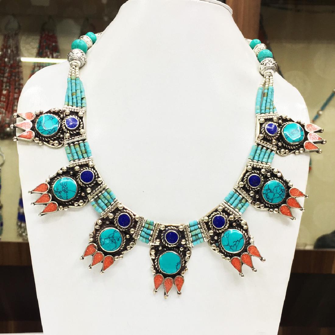Tibetan Buddhist Turquoies & Coral Tibetan Necklace: Item: Tibetan Buddhist Turquoies & Coral Tibetan Necklace Handmade Origin: Tibetan Metal Purity: Tibetan silver Gemstones: Turquoise & Coral Size (inches): 20 Please note that this lot has a confident