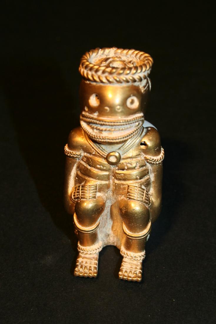 Pre-Columbian art in tumbago. Figure of carnivore man (1 of 8)