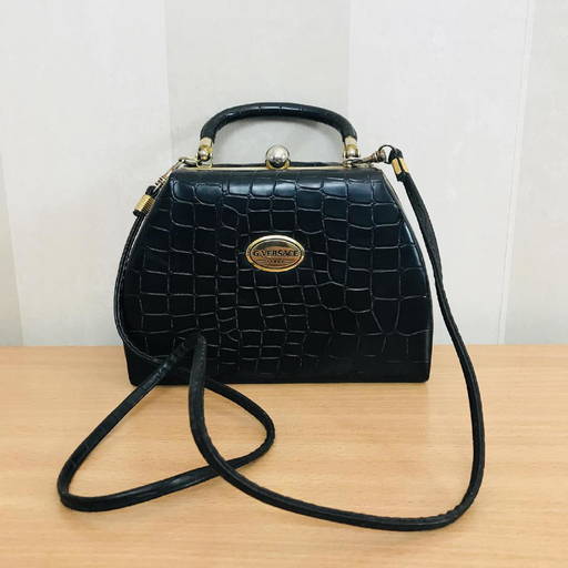 At Auction: Versace Virtus Top Handle Bag Leather Medium Brown