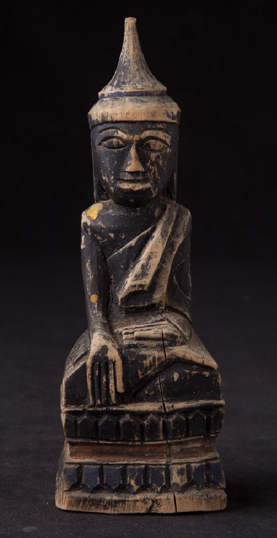 Antique wooden Shan Buddha statue: Material: Wood; 16,5 cm high; 5,7 cm wide and 4,1 cm deep; Shan (Tai Yai) style; Bhumisparsha Mudra; 19th century; Originating from Burma Please note that this lot has a confidential reserve. When you