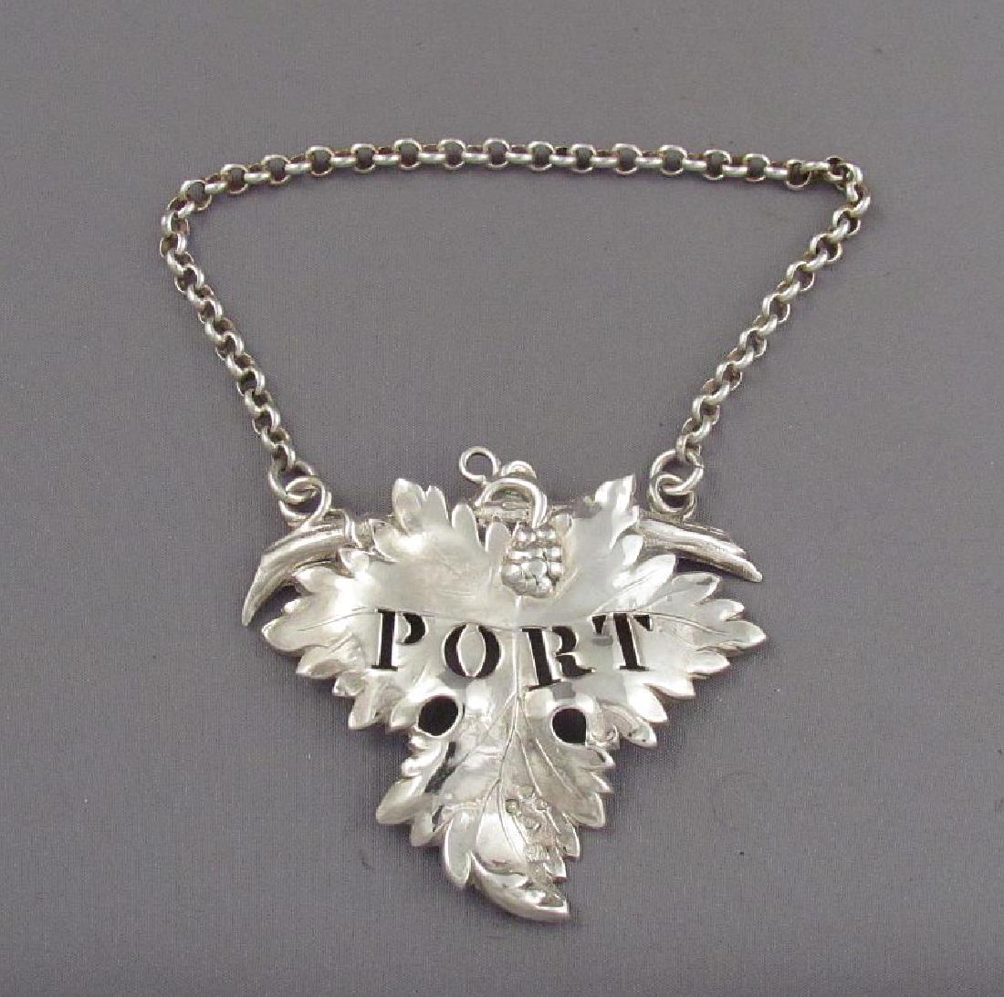 Heavy Sterling Silver Port Wine Label: Item: Heavy Sterling Silver Port Wine Label Maker/Designer: Rawlings & Summers Origin: England Date/Period: 1850 Silver Purity: 92.50% Size: 2.75in Item Weight: 26g Hallmarks: London 1850 A large, hea