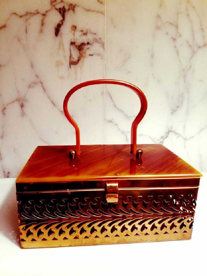 Bakelite 1930 Purse Gold Filigree metal: No Reserve! From the 1930's very sought after in colorationand year.Very good conditionfor its age. Bakelite was positive and was tested with Simichrome. Clasp is perfect and in working order. This on