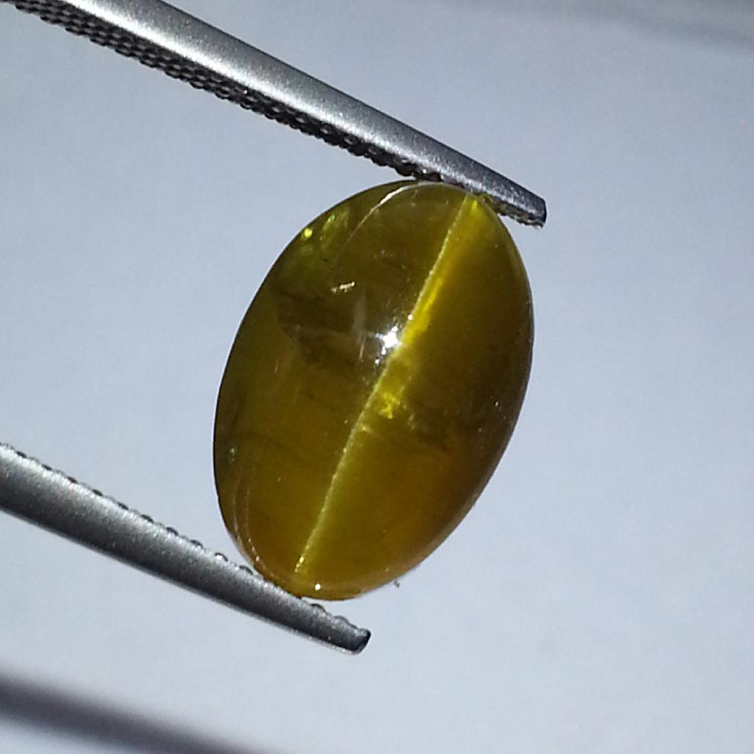 Top Grade Natural Apatite cat's Eye - 9.40 ct: No Reserve! Item: Top Grade Natural Apatite cat's Eye - 9.40 ct Color/Clarity: Opaque Loose gemstone Carat Weight: 9.4 Size (mm): 13.70 x 9.20 x 8.30 Oval - Africa No Reserve: This lot starts at $1 an