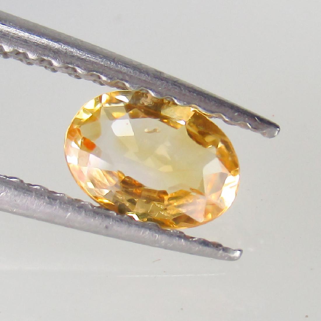 0.54 Ctw Natural Orange Sapphire Oval cut (1 of 2)