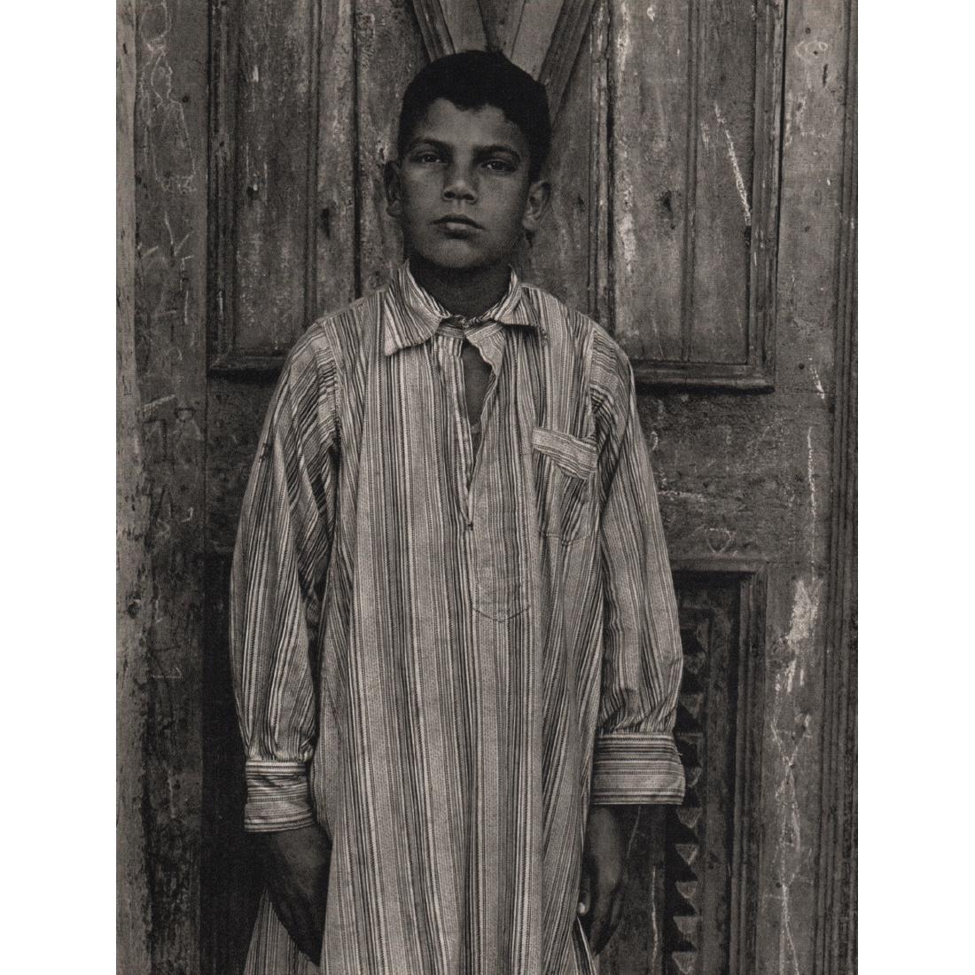 PAUL STRAND - Young Ali, Kalata al Kobra, Delta: Artist: PAUL STRAND Print Title: Young Ali, Kalata al Kobra, Delta Medium: Sheet-Fed Gravure Printing Date: 1960's Printed in Germany Image Size: 7 X 9 inches Paul Strand (1890–1976) was an American