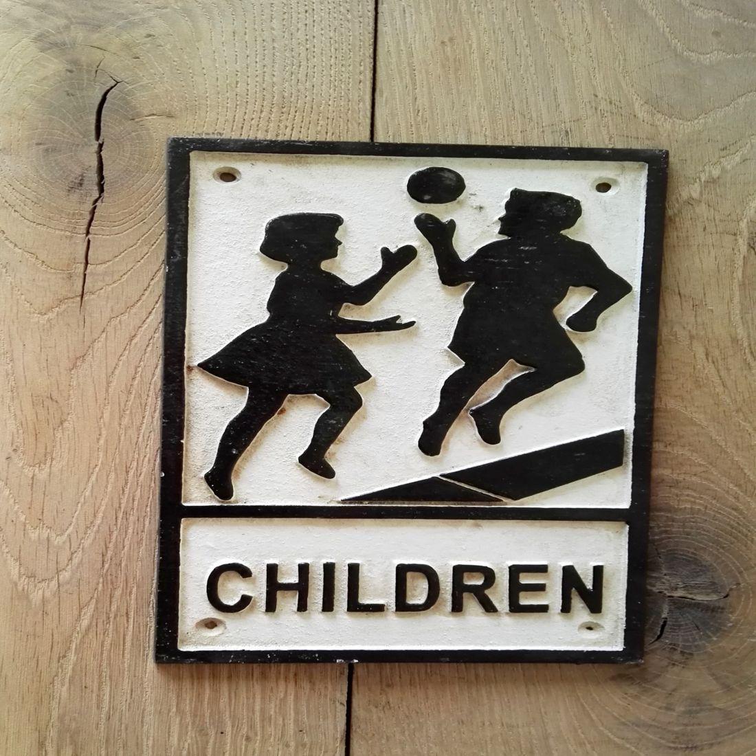 Old 'Children playing' road sign: Reserve Reduced! Title: Old 'Children playing' road sign Maker: unknown Origin: United Kingdom Date/Period: 20th century Materials: Cast iron Dimensions: Height: 30.4 cm Width: 18.2 cm A lovely old ro
