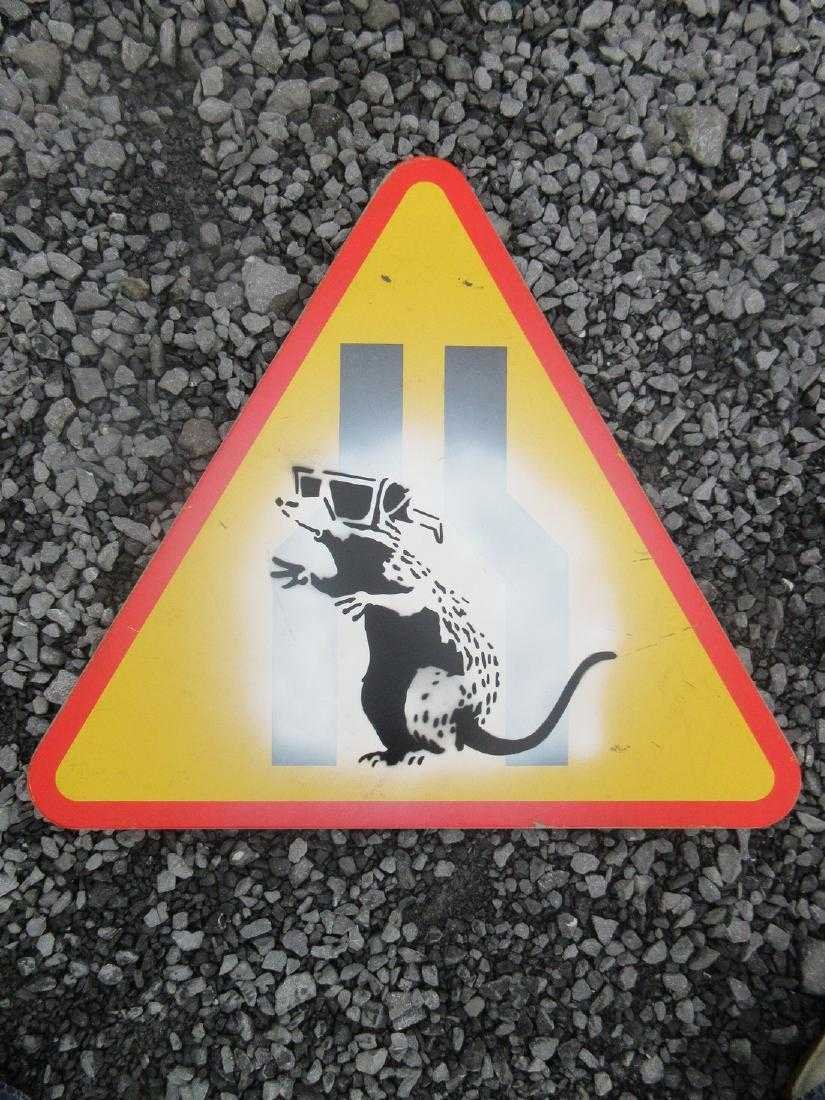 Banksy, Attributed 3d Rat Spray Paint on Metal Road: Reserve Reduced! Title: Banksy 3D Rat spray paint on metal road sign Size Weight is 6 kilos and size is 33" X 37" inches This is being sold as attributed to Banksy as pest control will not issue COA's