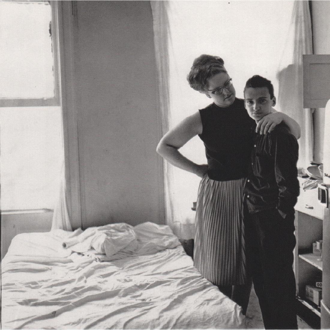 DIANE ARBUS - Two Friends at Home, NYC 1965: Artist: DIANE ARBUS Print Title: Two Friends at Home, New York City 1965 Medium: Sheet-fed Gravure Printing Date: 1970's Printed in Switzerland Image Size: 7 x 7 inches Diane Arbus (1923-1971) was an 