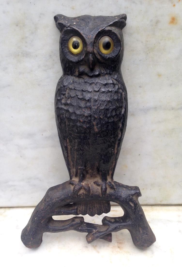 Cast iron owl in old black paint.: Cast iron owl in old black paint. C1940's 15" high. 9 1/2" wide Nice finish. Made in the same casting as andirons but never used that way. Please note that this lot has a confidential reserve. When yo