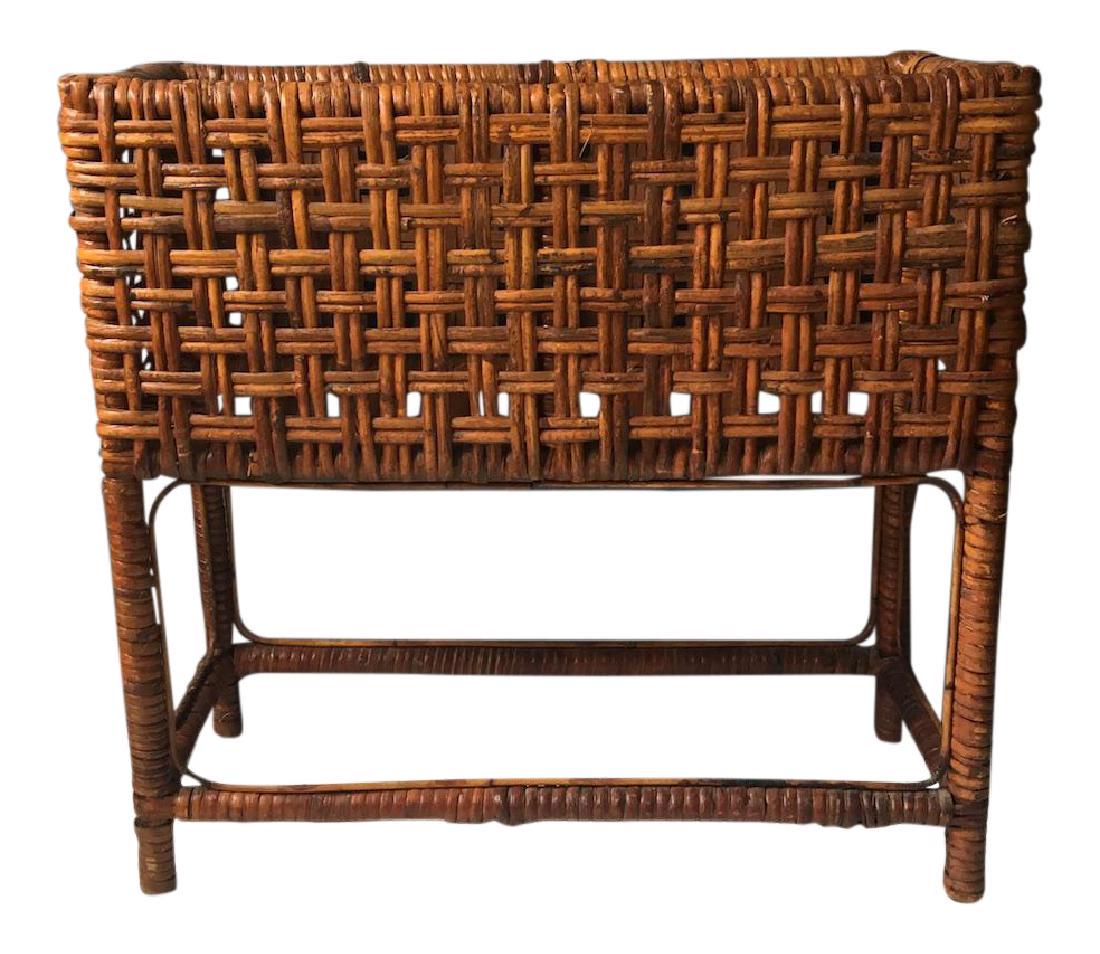 1960s Brown Rattan Planter Box: Reserve Reduced! New to Jasper52 Item: 1960s Brown Rattan Planter Box Date/Period: 1960s Dimensions: 21" w x 9" d x 20" h Vintage brown rattan planter box, floor standing with wrapped legs. Open weave