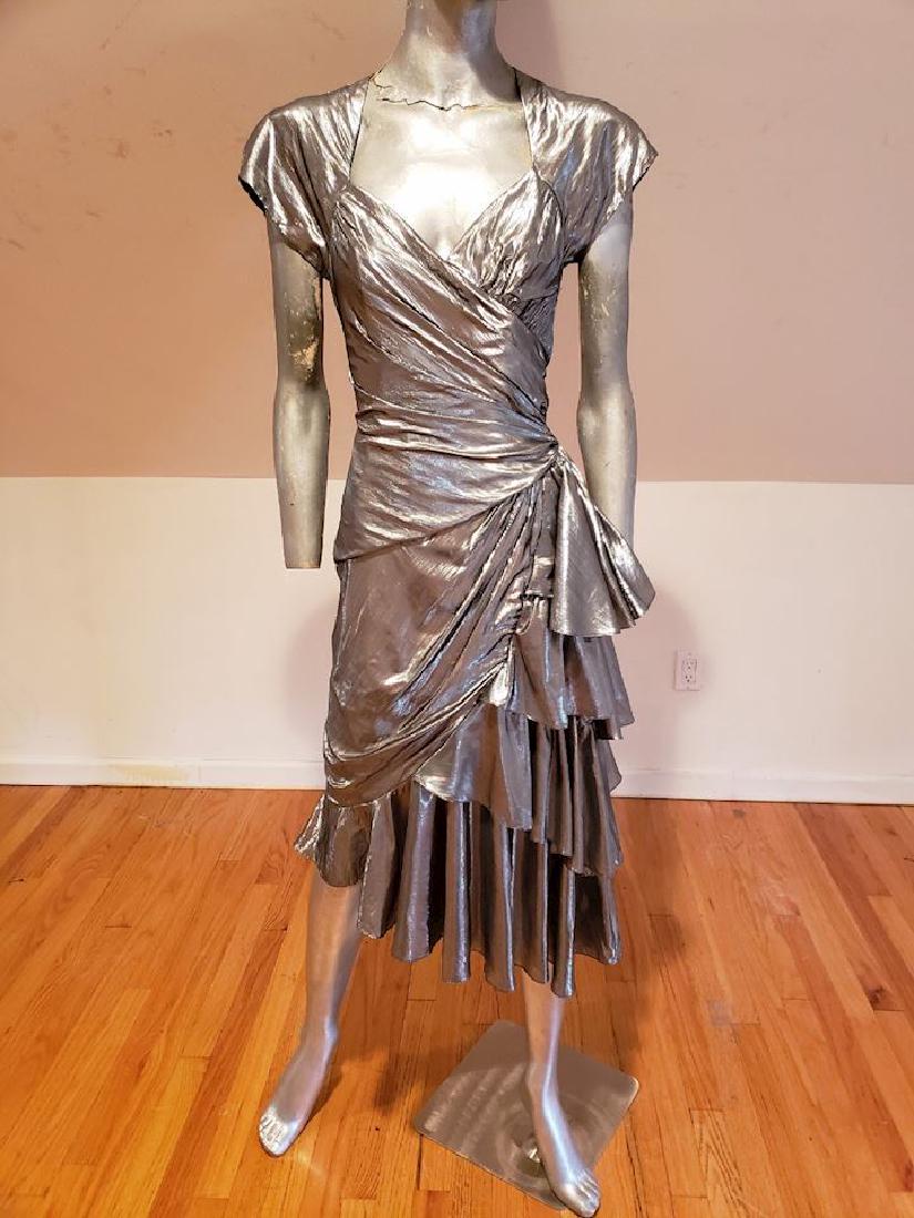 Casadei avant Garde silver lame signed 80's dress: No Reserve! No Reserve! Signed by Eletra Casadei in 1982 Disco Avant garde silvr lame' draped pleated dress.Dramatic side swags backless opn design vry Rare and a beauty. Will fit a size S/M Bust-34-3